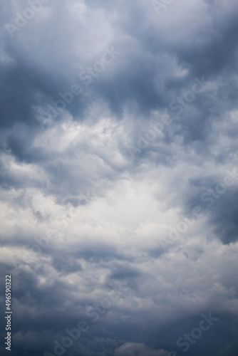 Beautiful and formidable sky with blue thunderclouds before the storm. Dramatic sky background, space for inscription.
