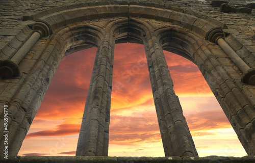 egglestone abbey arched window with sunset skies photo