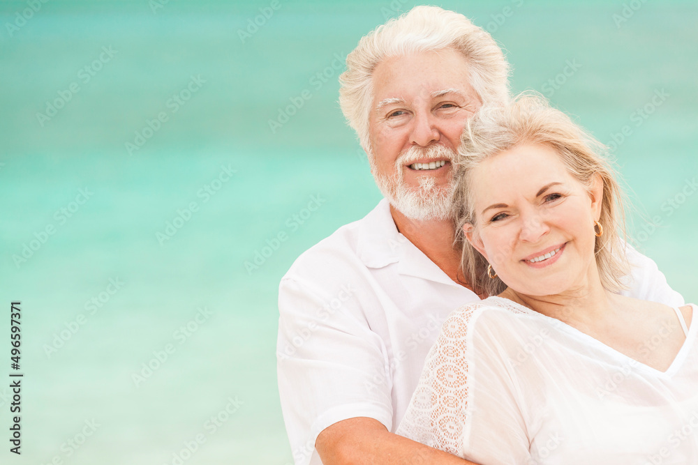 Loving mature Caucasian couple outdoors together on tropical beach