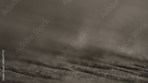 shot of black oak wood surface with light pattern