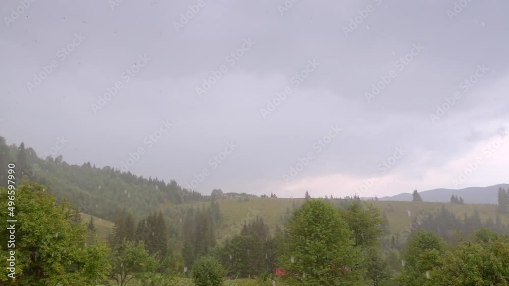Summer downpour over the green summer mountain hills. Slow motion clip 240 fps. Summer downpour over the green summer mountain hills. Slow motion clip 240 fps.