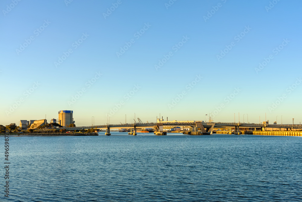 Industrial area of Port Adelaide with the bridge across the Port River at sunset, South Australia Industrial area of Port Adelaide with the bridge across the Port River at sunset, South Australia