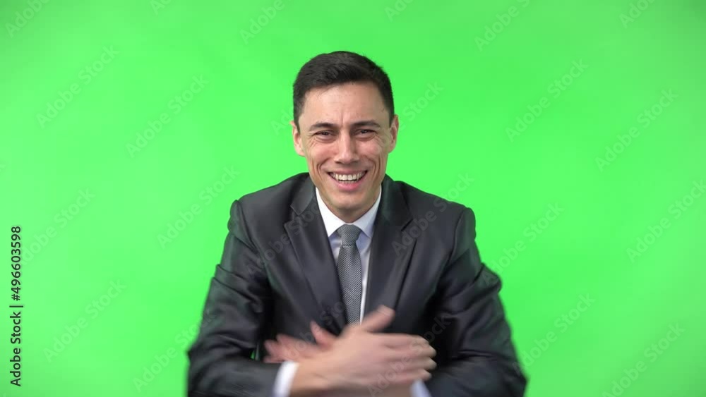 Astonished young businessman looking at camera with outstretched arms Astonished young businessman looking at camera with outstretched arms