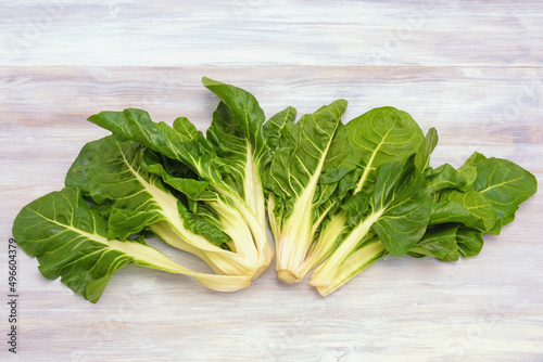 Balkan cuisine. Blitva, chard leaves - popular leafy vegetables on rustic table. Copy space photo