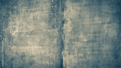 Interior background with texture of old painted concrete wall with peeling plaster.