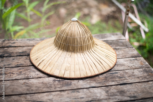 Bamboo hat vintage on woowd table.