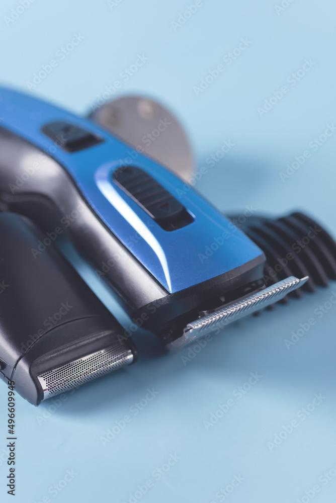 Modern Battery Electric Shaver for Man on Blue Background with Clipping Path Close Up Vertical Modern Battery Electric Shaver for Man on Blue Background with Clipping Path Close Up Vertical