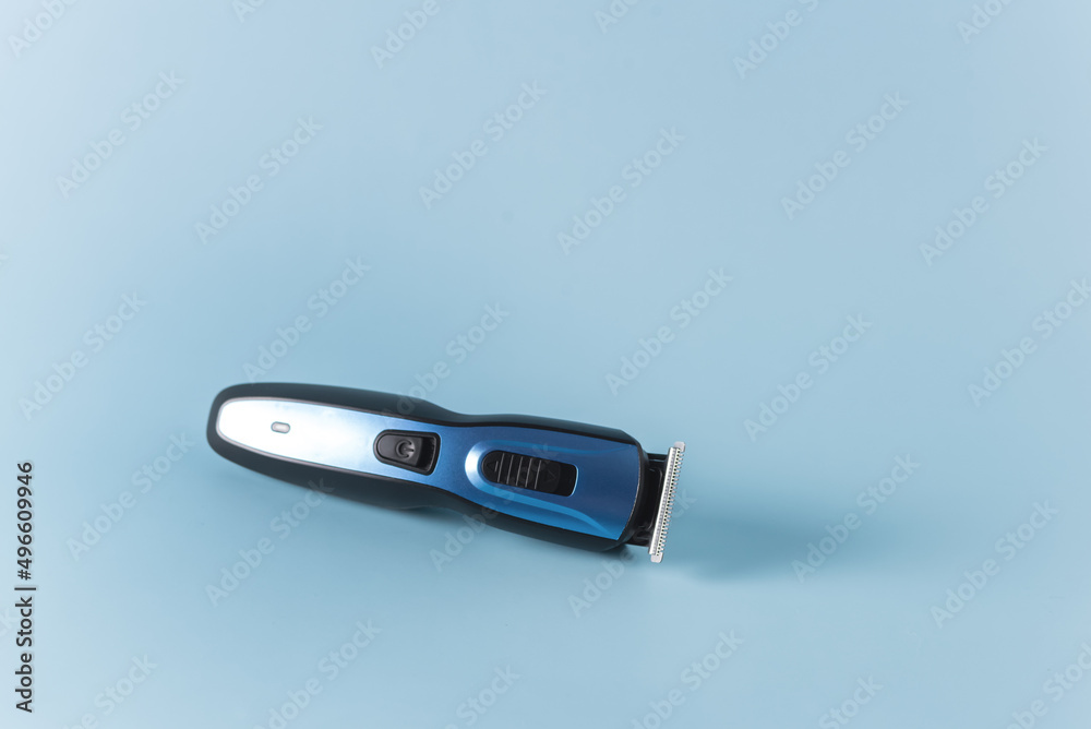 Modern Battery Electric Shaver for Man on Blue Background Horizontal Copy Space Modern Battery Electric Shaver for Man on Blue Background Horizontal Copy Space