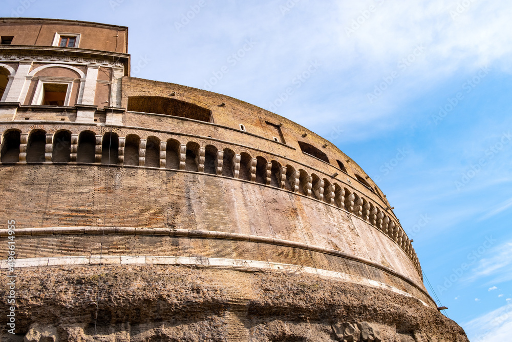 External walls of main rotunda of Castel Sant'Angelo mausoleum - Castle of the Holy Angel at Tiber river embankment in historic center of Rome in Italy
