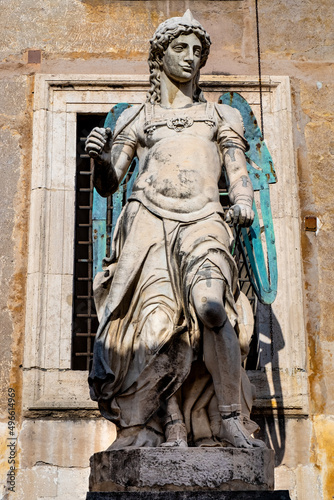 Original statue of Michael the Archangel by Raffaello da Montelupo in front of Castel Sant'Angelo Saint Angel Castle in historic center of Rome in Italy photo