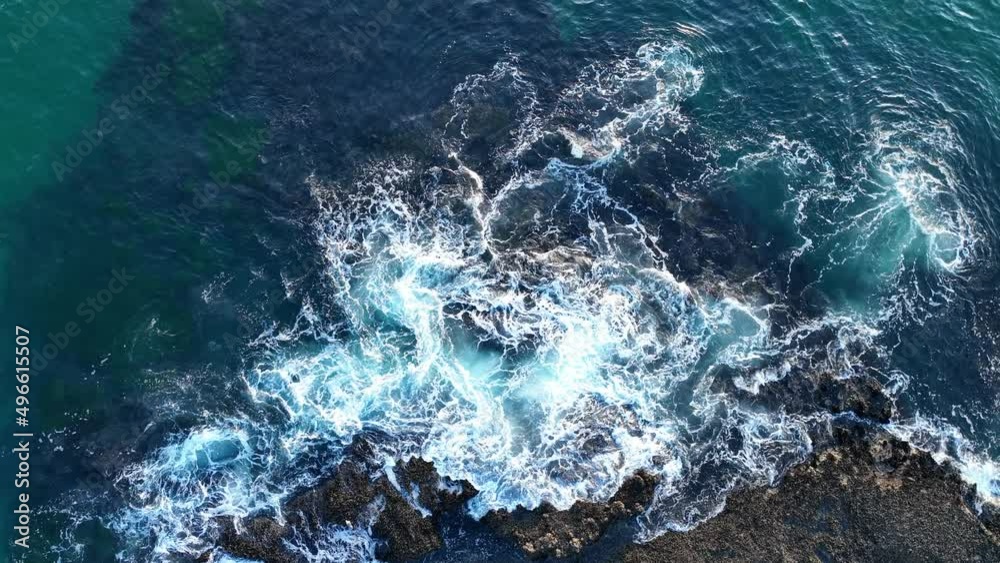Sea waves breaking over rocks. Aerial view of waves and some of rocks, aerial view of drone.