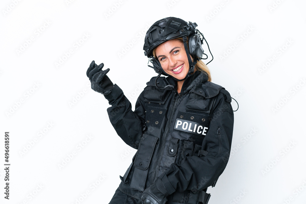 SWAT caucasian woman isolated on white background making guitar gesture SWAT caucasian woman isolated on white background making guitar gesture