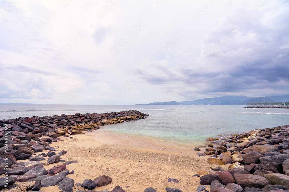 Beautiful seascape with stone brakwater on the beach. Beautiful seascape with stone brakwater on the beach.