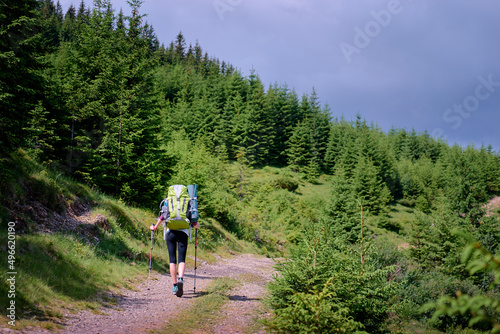 Active lifestyle. Trekking and hiking.Tourist with backpacks in the mountains forest.