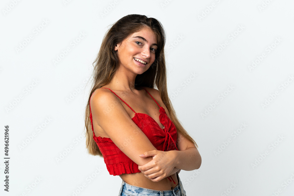 Young caucasian woman isolated on white background with arms crossed and looking forward Young caucasian woman isolated on white background with arms crossed and looking forward