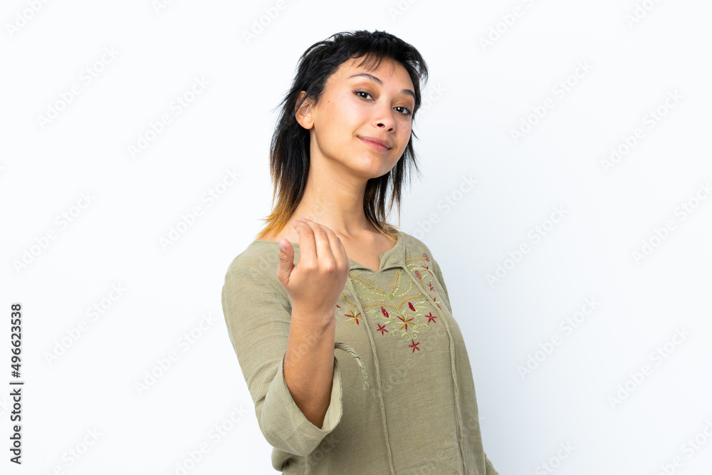 Young Uruguayan girl over isolated white background inviting to come with hand. Happy that you came Young Uruguayan girl over isolated white background inviting to come with hand. Happy that you came