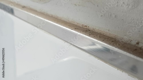 Black ants on the windowsill on the balcony