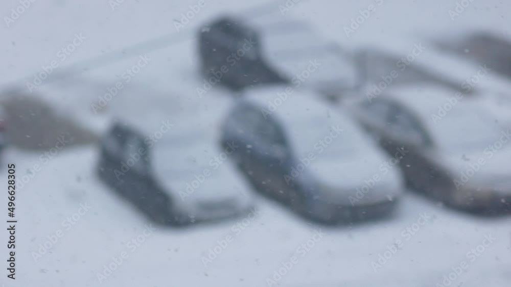 Snowfall in the city, a car in the parking lot is covered with snow.Selective focus, shallow depth of field.Cars in snowdrifts. Road congestion due to snowfall Snowfall in the city, a car in the parking lot is covered with snow.Selective focus, shallow depth of field.Cars in snowdrifts. Road congestion due to snowfall