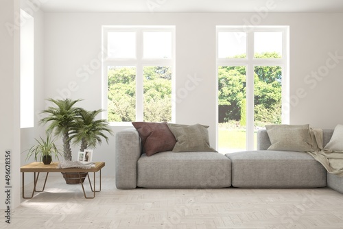 White living room with sofa and summer landscape in window. Scandinavian interior design. 3D illustration © AntonSh