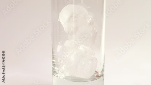 Preparation of carbonated beverage with ice and lemon. photo