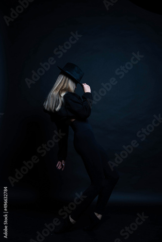 girl in black in the studio in a dark key