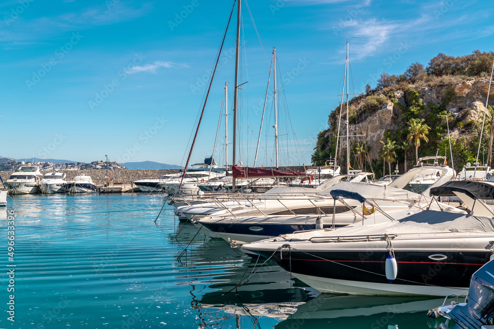 Bay area situated in la provincial de Granada. Beautiful harbour with luxury yachts docked in a small bay. All the dock area surrounded by restaurants