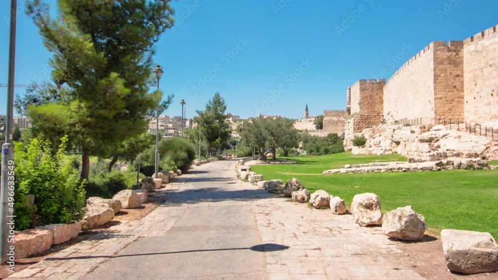 Defensive wall of the ancient holy Jerusalem timelapse hyperlapse, lit by the bright sun. Defensive wall of the ancient holy Jerusalem timelapse hyperlapse, lit by the bright sun.