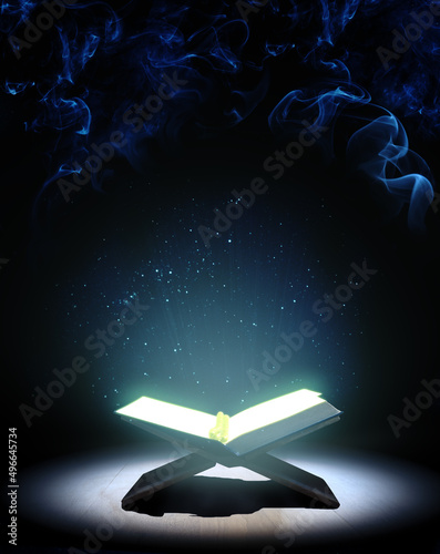 Valokuvatapetti Quran or Kuran, the islamic holy book, in dark background