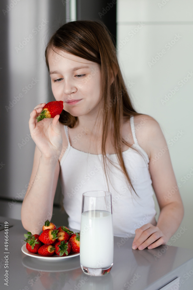 Preteen Girl Holding Raw Straberry Eating Healthy Food Drinking Milk
