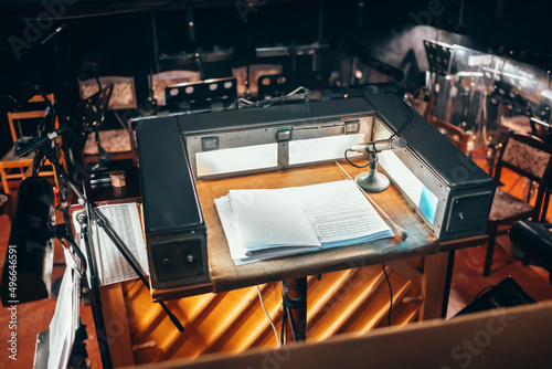 The conductor's place is in the orchestra pit. A notebook with notes. photo