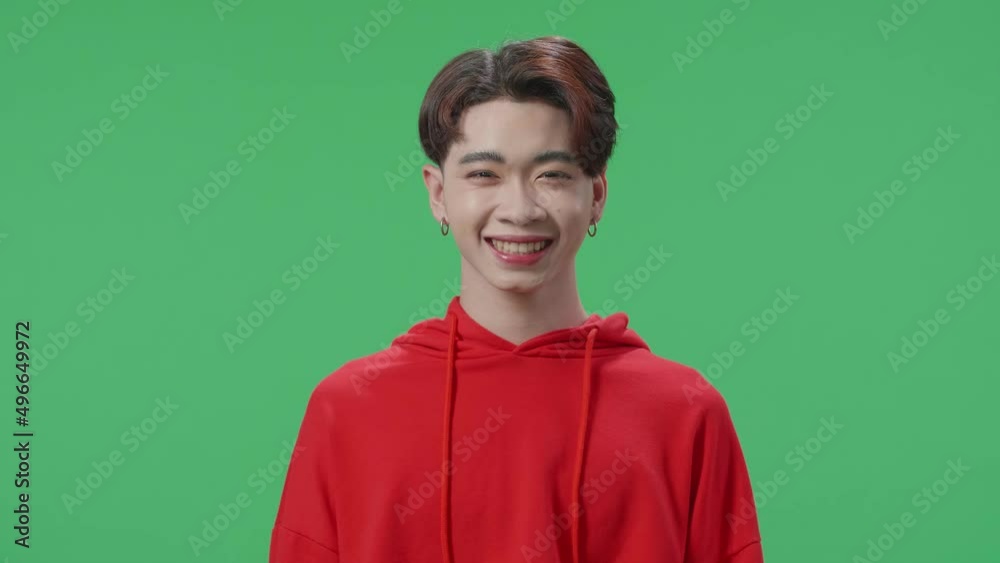 Smiling Asian Transgender Male Looking At Camera In The Green Screen Studio
Smiling Asian Transgender Male Looking At Camera In The Green Screen Studio