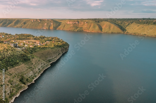 Magnificent aerial view of the Dniester River with picturesque banks. Bakota National Natural Park, Podolskie Tovtry, Ukraine. Beautiful view from a flying drone.
