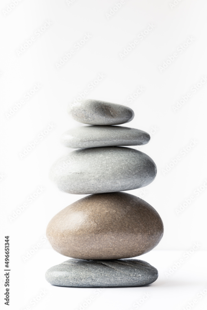 Closeup view of a pyramid of five pebbles of various sizes, shapes, and colors Closeup view of a pyramid of five pebbles of various sizes, shapes, and colors