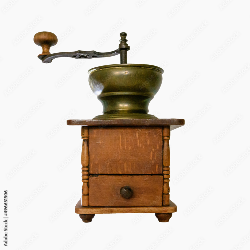 Antique manual coffee grinder isolated on white background Antique manual coffee grinder isolated on white background