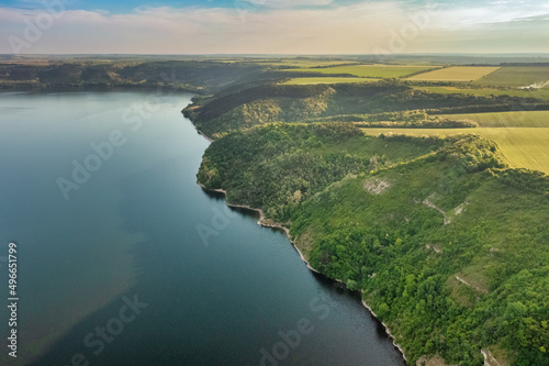 Fototapeta Naklejka Na Ścianę i Meble -  Magnificent aerial view of the Dniester River with picturesque banks. Bakota National Natural Park, Podolskie Tovtry, Ukraine. Beautiful view from a flying drone.
