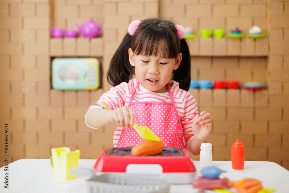 young girl pretend playing food preparing at home young girl pretend playing food preparing at home