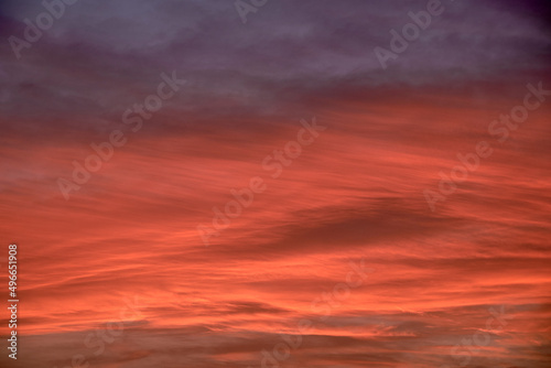 Sky light after sunset. orange background, clouds © Raul