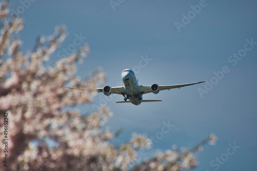An airplane flying in the spring sky.  Richmond BC Canada
