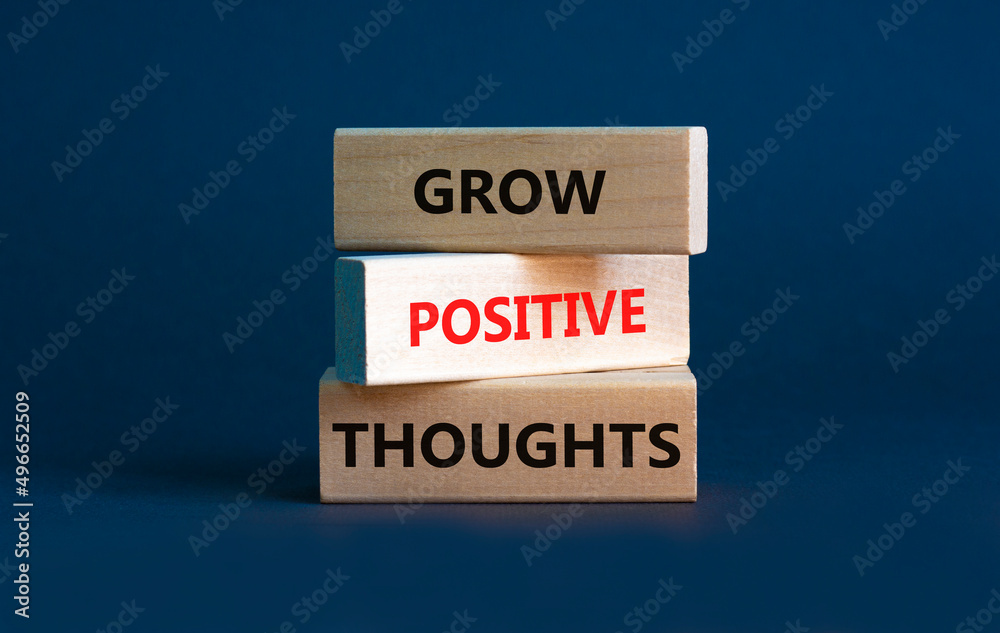 Grow positive thoughts symbol. Concept words Grow positive thoughts on blocks. Beautiful grey background. Business grow positive thoughts concept. Copy space.