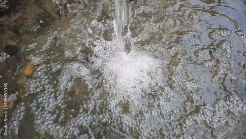 Footage of water spring through bamboo in rural. Natural water. File 5