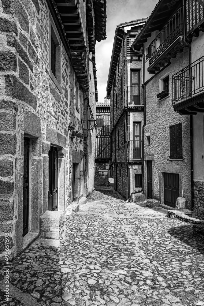 Alley with mountain houses of stone construction in the Pool, Salamanca.