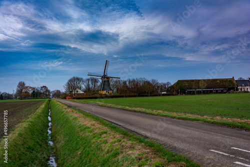 Beautiful view of an old dutch windmill and a perspective