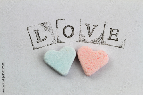 Obraz na płótnie Word love made with letter stamps and big red heart on white background
w salonie