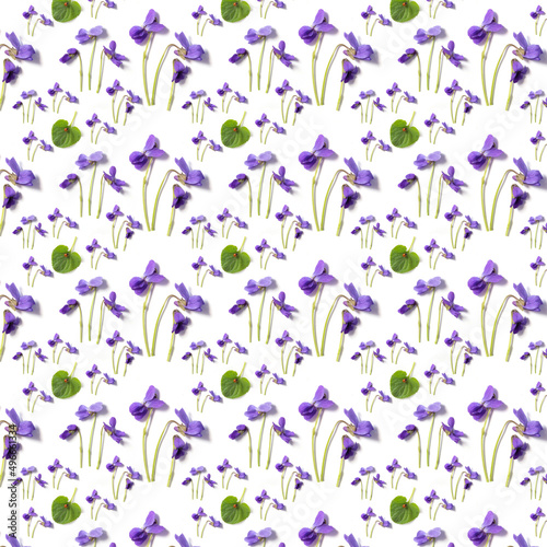 Flower patern. Amazing pattern of violet and green leaves on a white background.