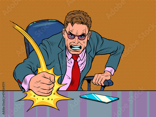The evil businessman boss hits the table with his fist. Emotions in the office. Angry boss