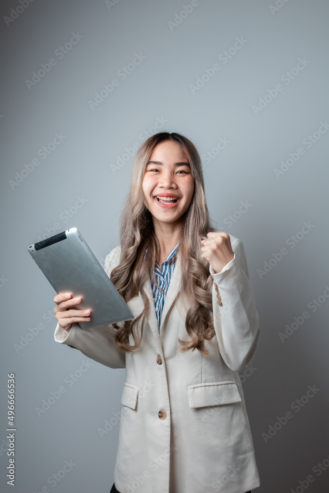 Success woman showing thumbs up. Excited beautiful woman isolated on white background. Mixed Asian Caucasian model Success woman showing thumbs up. Excited beautiful woman isolated on white background. Mixed Asian Caucasian model