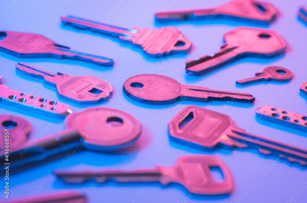 Fototapeta premium Collection of silver key on blue background