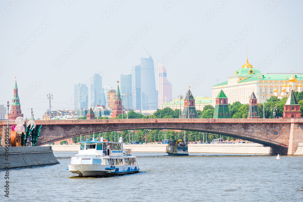 View of the Kremlin and skyscrapers Moscow City from the pleasure ship on the Moskva river, Russia