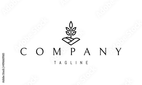 Obraz na plátně Vector logo on which an abstract image of a plant on the background of a plowed field