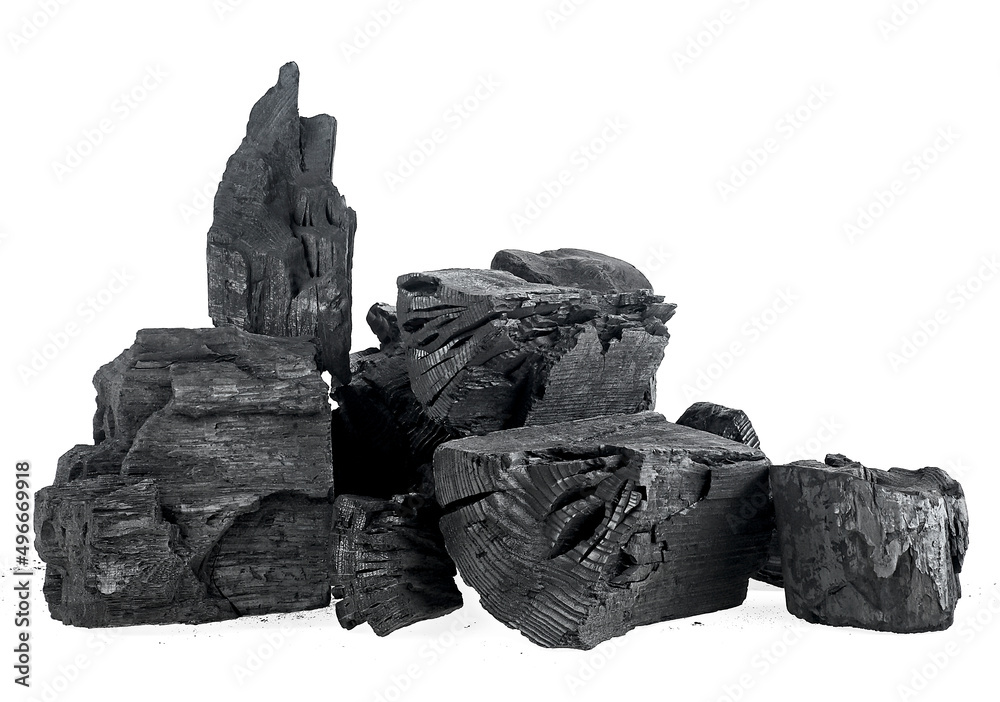 Pile of hardwood charcoal isolated on a white background. Natural wood charcoal. Black charcoal chunks.